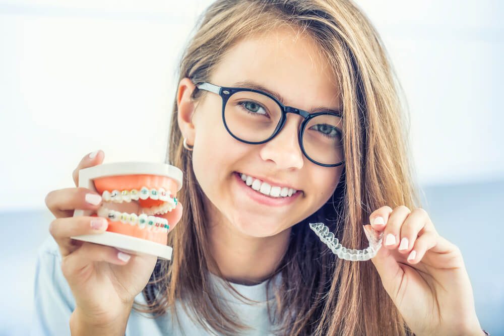 Orthodontic and quality of life: A little girl showing braces